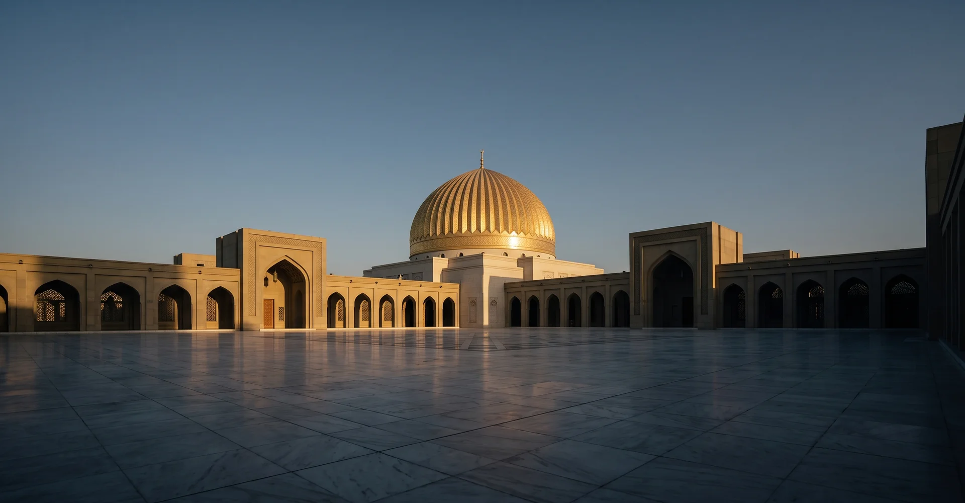 Empty marble plaza facing a ribbed golden dome in low sun