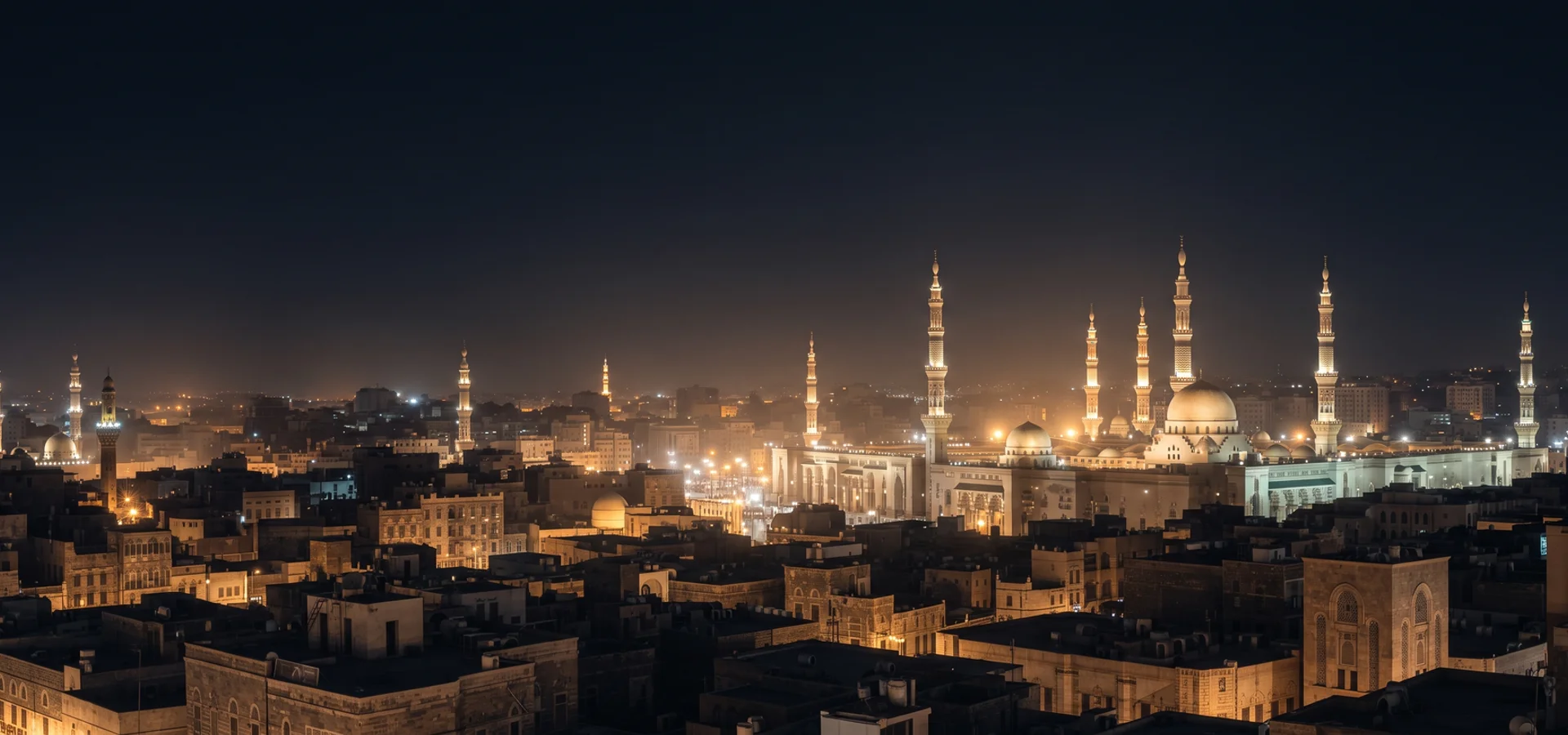 Night skyline of a holy city with minarets and low rooftops